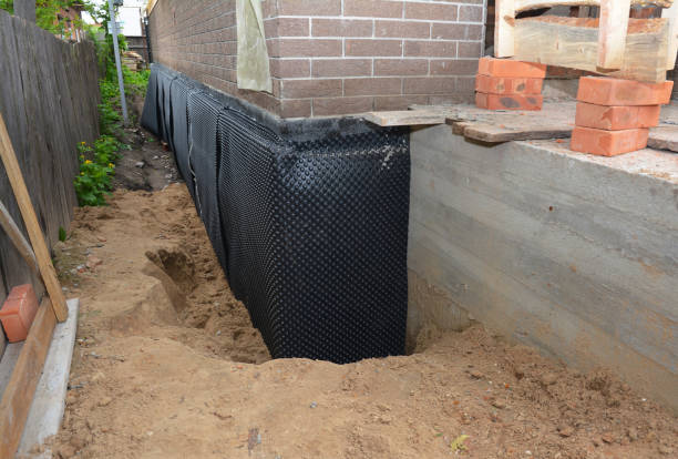 Happy homeowners after waterproofing job in Buena